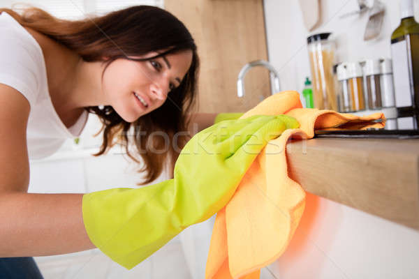 Close-up Of Woman Cleaning Induction Stove Stock photo © AndreyPopov