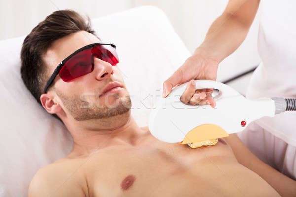 Człowiek laserowe leczenia skóry młody człowiek zdrowych Zdjęcia stock © AndreyPopov
