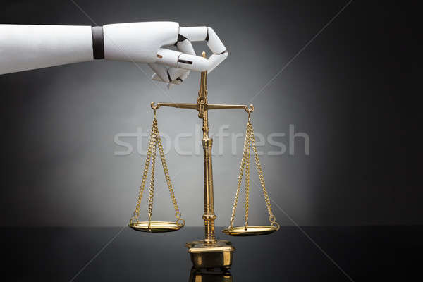 Robot's Hand Holding Justice Scale Stock photo © AndreyPopov
