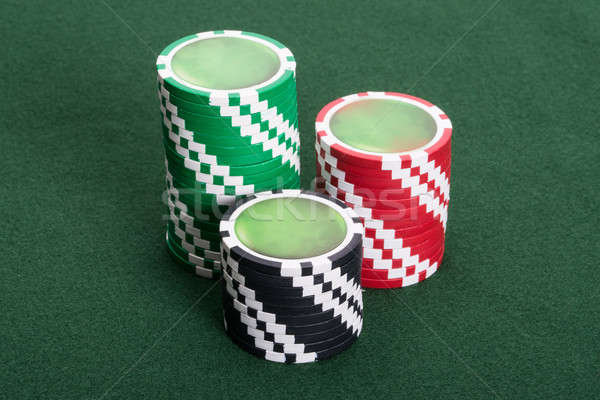 Casino chips on poker table Stock photo © AndreyPopov