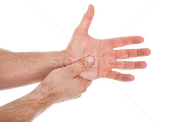 Person Pressing Palm With Thumb Stock photo © AndreyPopov