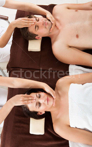 Relaxed Couple Receiving Head Massage At Beauty Spa Stock photo © AndreyPopov