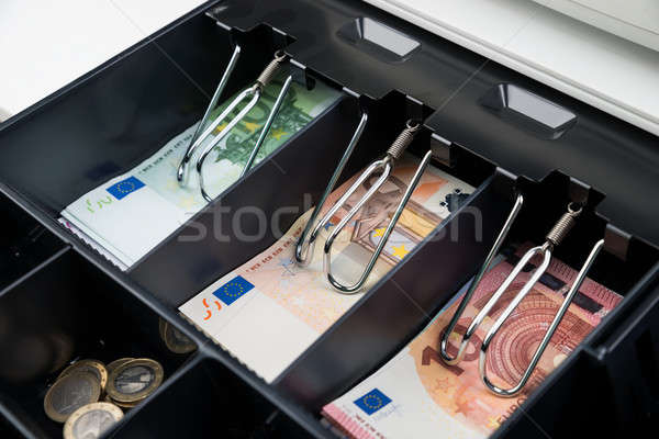 Coins And Banknote In Cash Register Stock photo © AndreyPopov