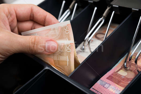 Stock photo: Person Hands With Money Over Cash Register