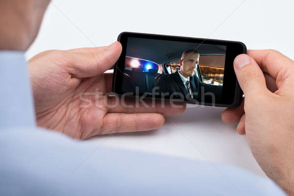 Person Watching Video On Mobile Phone Stock photo © AndreyPopov