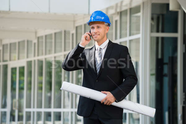 Engineer With Blue Print Talking On Cellphone Stock photo © AndreyPopov
