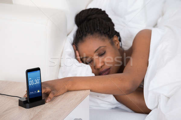 African Woman Sleeping On Bed Stock photo © AndreyPopov