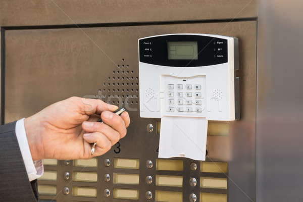 Businessperson Hand Operating Security System Stock photo © AndreyPopov
