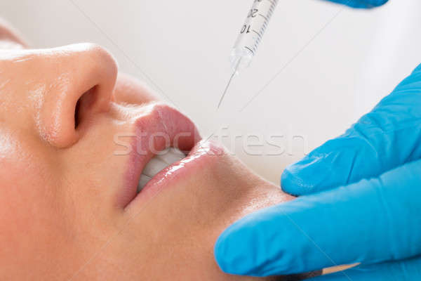 Woman Receive Cosmetic Injection On Lip Stock photo © AndreyPopov