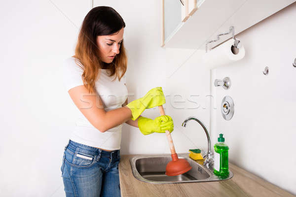 Woman With Plunger Near The Sink Stock photo © AndreyPopov