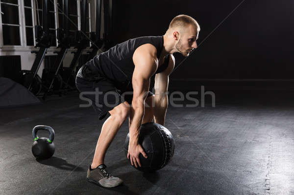 Man Doing Exercise With Medicine Ball Stock photo © AndreyPopov