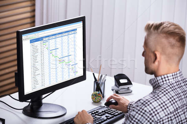 Businessman Working On Gantt Chart Stock photo © AndreyPopov