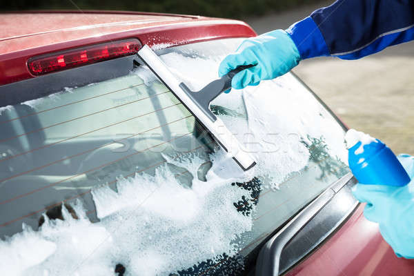Person's Hand Washing Rear Windshield Stock photo © AndreyPopov