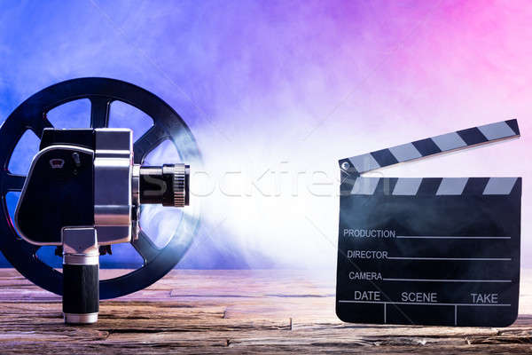 Filmkamera Filmrolle Bord beleuchtet Holz Stock foto © AndreyPopov