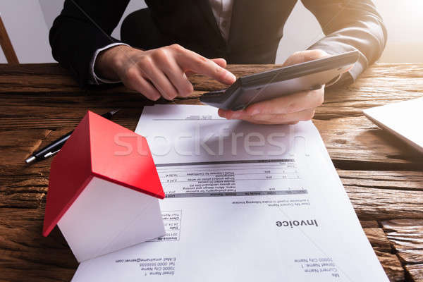 üzletember számológép számla ház modell asztal Stock fotó © AndreyPopov
