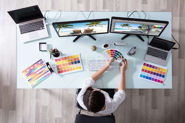 Designer Using Color Swatch While Working On Multiple Computer Stock photo © AndreyPopov