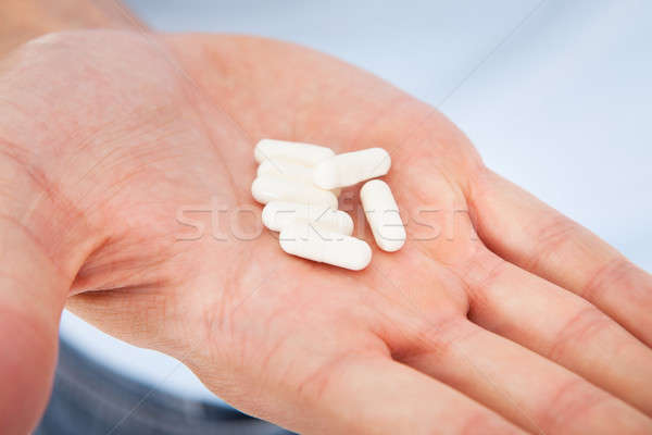Hand Holding Medicines Stock photo © AndreyPopov