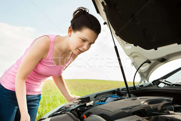 Woman Looking Under Hood Car Stock photo © AndreyPopov