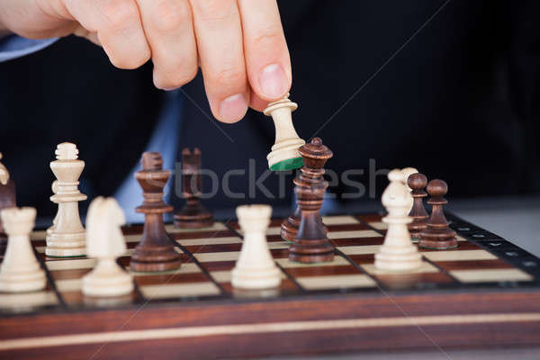 Human hand playing chess Stock photo © AndreyPopov