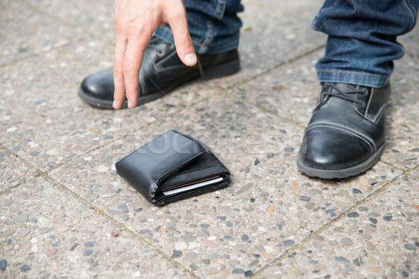 Man Picking Up Fallen Wallet Stock photo © AndreyPopov