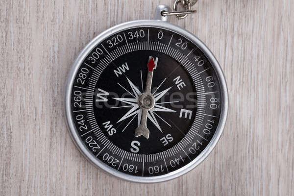 Compass On Wooden Table Stock photo © AndreyPopov