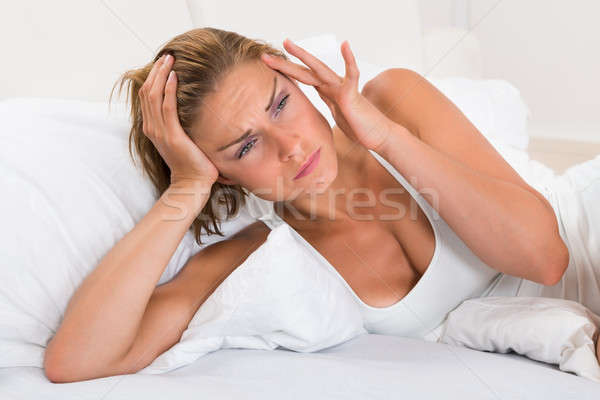 Woman Having Headache Stock photo © AndreyPopov