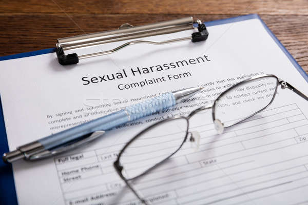 Szexuális zaklatás panasz űrlap toll közelkép asztal Stock fotó © AndreyPopov
