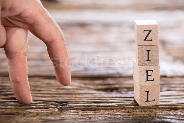 Person's Finger Walking Towards Ziel (Goal in German) Word Stock photo © AndreyPopov