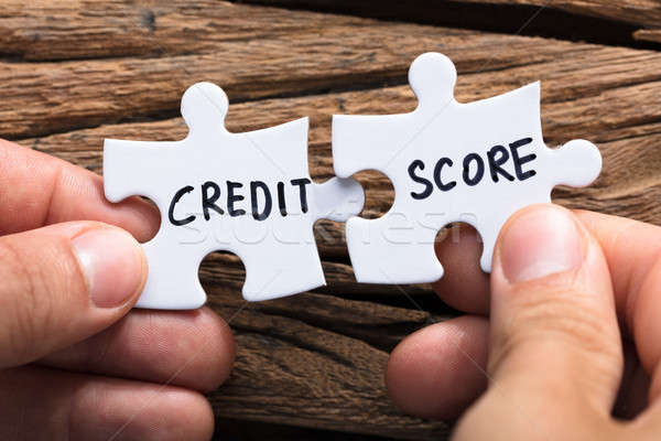 Hands Connecting Credit Score Jigsaw Pieces Stock photo © AndreyPopov
