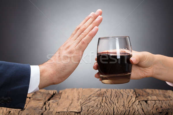 Businessperson Rejecting Glass Of Whiskey Stock photo © AndreyPopov