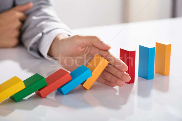 üzletember kéz tömés színes kockák zuhan Stock fotó © AndreyPopov