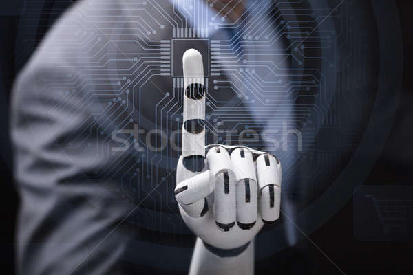 Robot's Finger Touching Computer Micro Chip Stock photo © AndreyPopov
