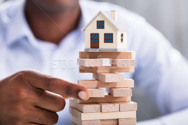 Person Holding Blocks With Miniature House Stock photo © AndreyPopov