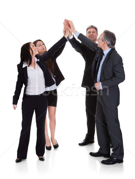 Group Of Businesspeople Raising Hand Together Stock photo © AndreyPopov