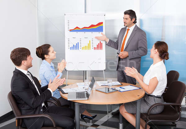Coworkers Applauding Businessman Stock photo © AndreyPopov