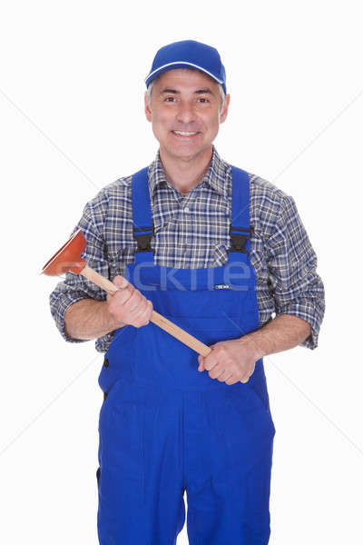 Portrait Of Male Plumber Holding Plunger Stock photo © AndreyPopov