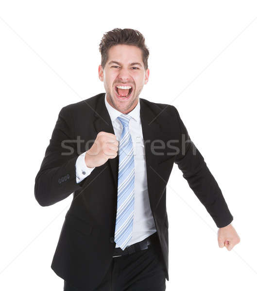 Successful Businessman Running Over White Background Stock photo © AndreyPopov