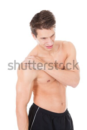 Junger Mann Leiden Schulterschmerzen Porträt muskuläre Mann Stock foto © AndreyPopov