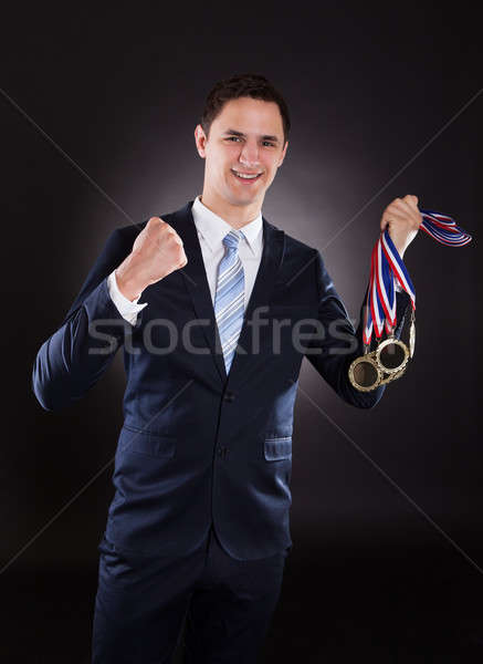 Lächelnd Geschäftsmann tragen Medaillen Porträt schwarz Stock foto © AndreyPopov