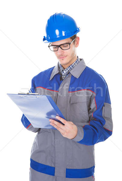 Male Construction Reviewer Holding Pen And Clipboard Stock photo © AndreyPopov