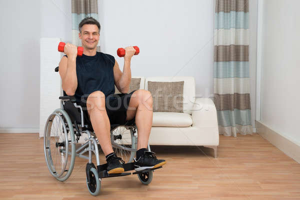 Handicapés homme fauteuil roulant maison [[stock_photo]] © AndreyPopov