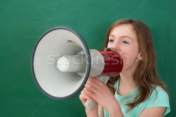 Lány bejelent megafon tábla osztályterem gyermek Stock fotó © AndreyPopov