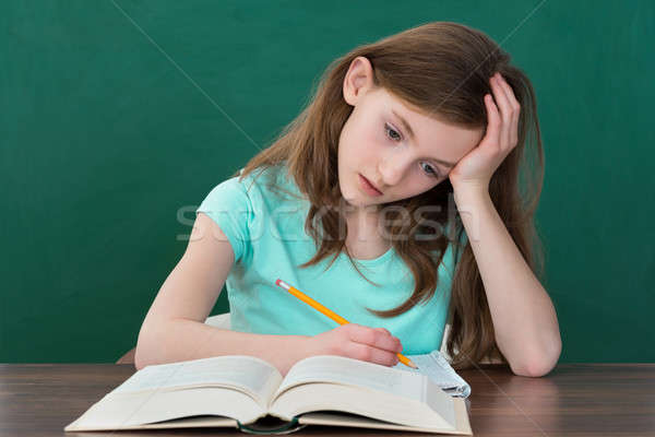 Thoughtful Girl Reading Books Stock photo © AndreyPopov