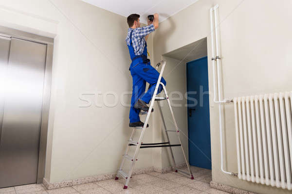 Stock photo: Technician Fitting Cctv Camera