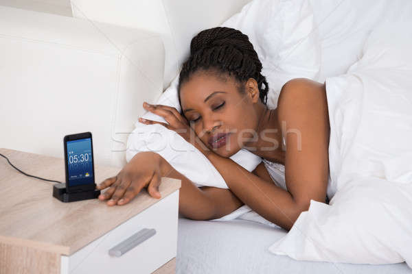 African Frau schlafen Bett jungen Alarm Stock foto © AndreyPopov