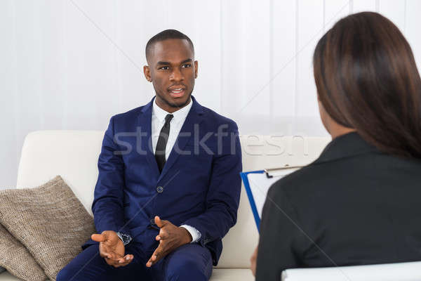Jonge man praten psycholoog problemen jonge afro-amerikaanse Stockfoto © AndreyPopov