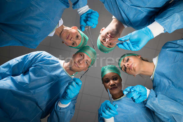 хирурги медицинской глядя камеры команда операционные комнаты Сток-фото © AndreyPopov