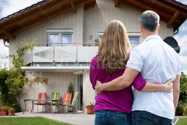 Couple Standing In Front Of Their House Stock photo © AndreyPopov