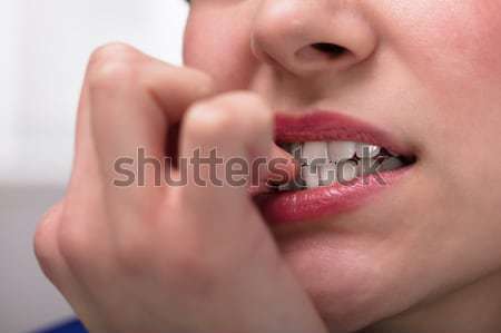 Businesswoman Biting Her Fingernail Stock photo © AndreyPopov