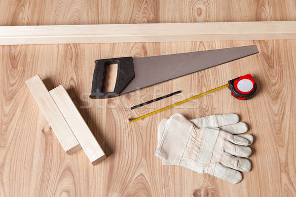 Stock photo: Carpenter tools and building plan